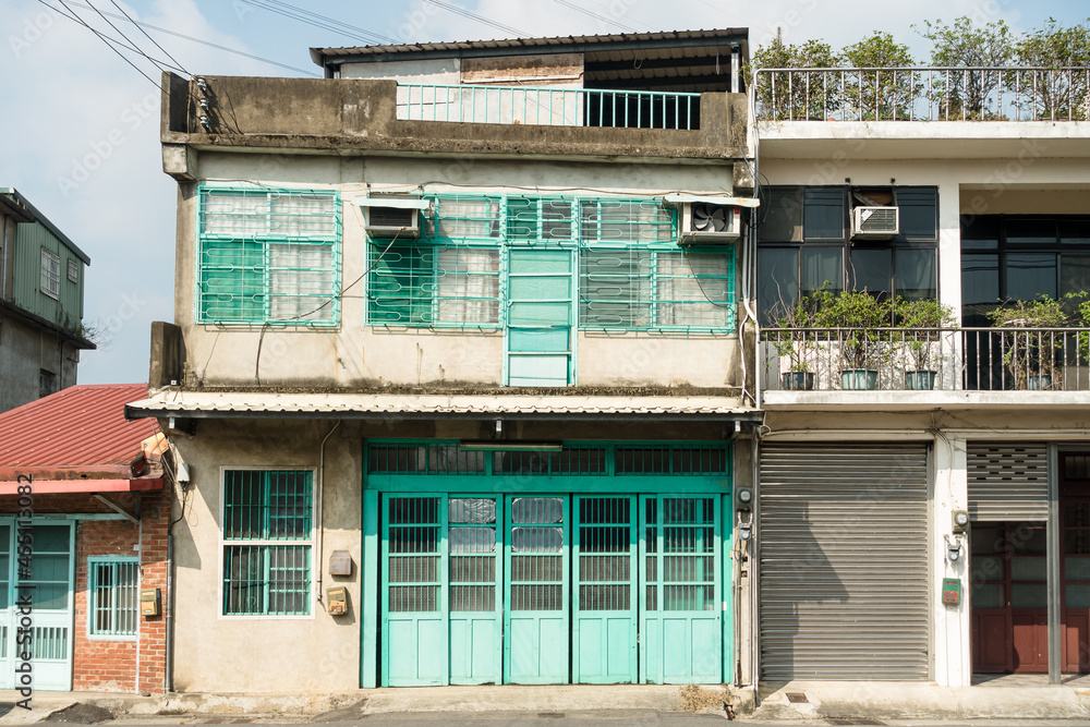 Old country building with green wooden doors and windows in Miaoli,Taiwan