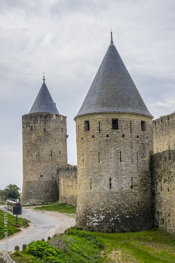 Medieval citadel at Carcassonne - huge and completely over-the-top, encompassing no less than 53 towers, enormous concentric walls, surrounded by a moat. Aude department, region of Occitanie, France. Medieval citadel at Carcassonne - huge and completely over-the-top, encompassing no less than 53 towers, enormous concentric walls, surrounded by a moat. Aude department, region of Occitanie, France.