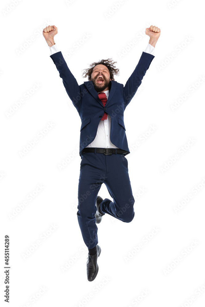 handsome businessman jumping high into the sky