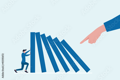 Domino effect of businessman pushing hard against falling domino. Business concept of falling prevention, stopping conflict, solving problem, chain reaction, successful intervention. 
