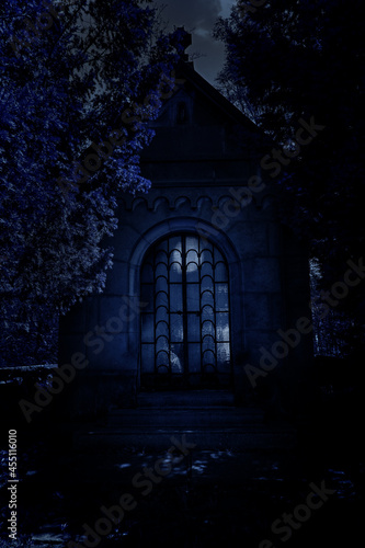 Family tomb in the cemetery with moonlight