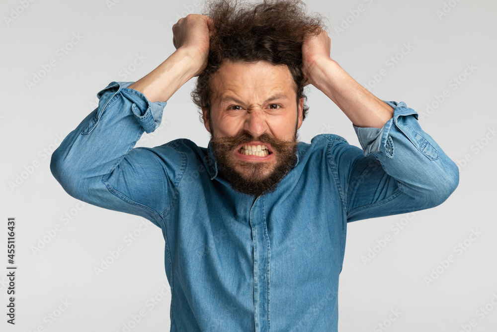 angry bearded man being nervous and pulling hair out angry bearded man being nervous and pulling hair out