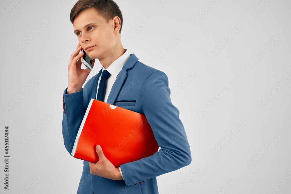 business man with documents talking on the phone office professional business man with documents talking on the phone office professional