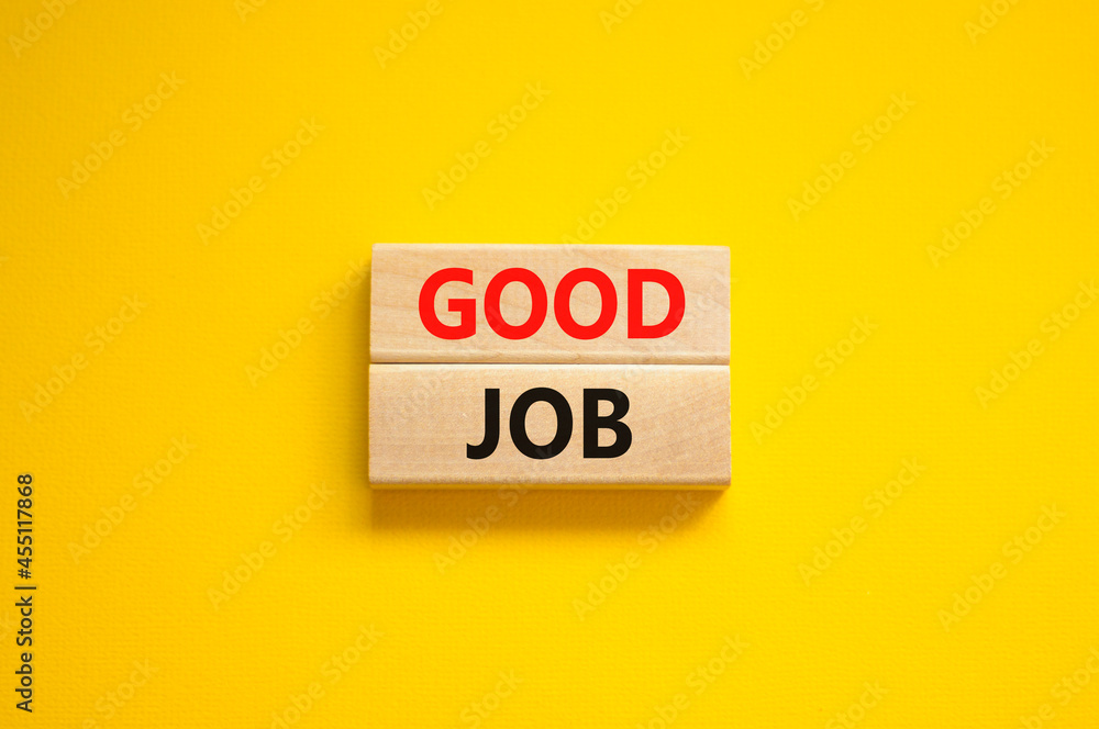 Good job symbol. Concept words 'good job' on wooden blocks on a beautiful yellow background. Business and good job concept, copy space. Good job symbol. Concept words 'good job' on wooden blocks on a beautiful yellow background. Business and good job concept, copy space.