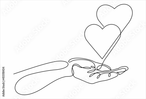 One continuous line drawing of hand holding heart.vector illustration