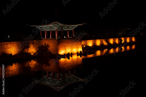korean palace at night with reflection