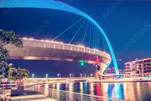Obraz na płótnie Beautiful incredible cityscape with Tolerance bridge near the water canal in Dubai, United Arab Emirates. w salonie