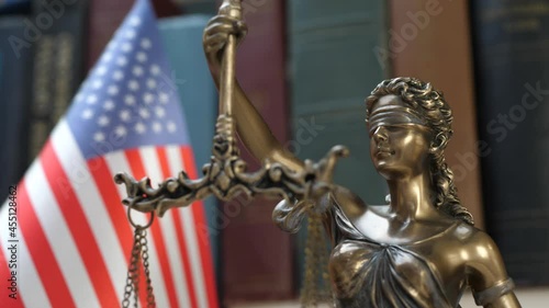 lady justice symbol with usa flag and bookshelf background concept