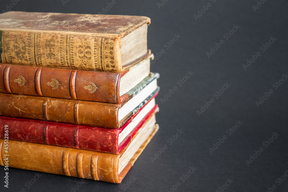 Stack of old books on dark background Stack of old books on dark background