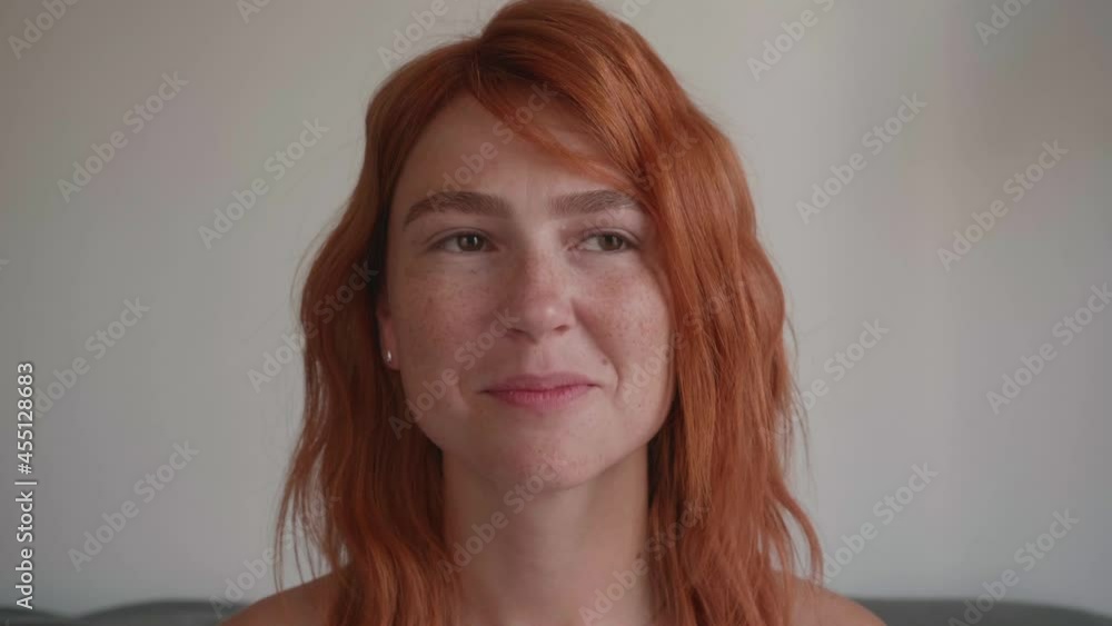 Attractive young girl with red hair making faces. Shows different emotions Attractive young girl with red hair making faces. Shows different emotions