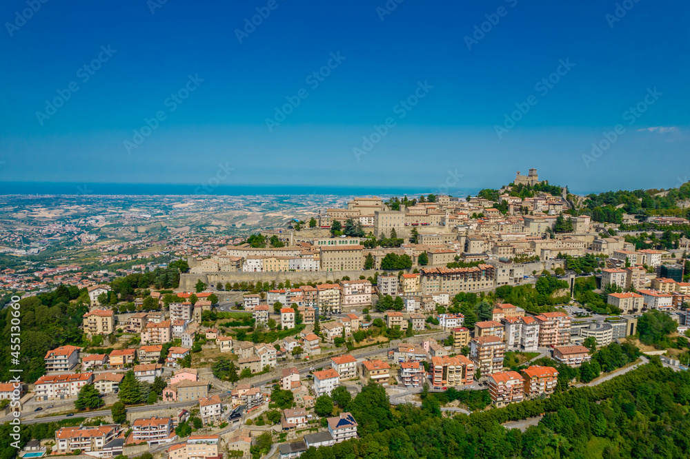 Aerial view of San Marino old town on the hill on a sunny day with clear sky