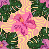 Tropical flowers and palm leaves on background. Seamless.