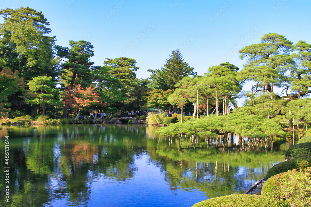 an autumn day (october 2020) on the verge of a pond of the japanese garden of Kanazawa (Kenroku-en), Ishikawa, Japan an autumn day (october 2020) on the verge of a pond of the japanese garden of Kanazawa (Kenroku-en), Ishikawa, Japan