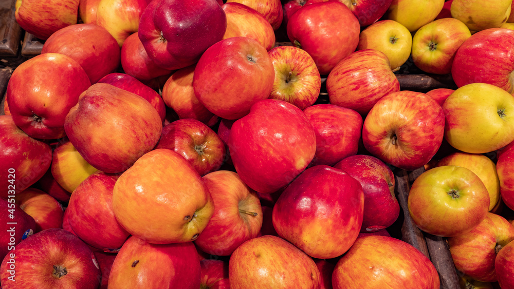 background of red apples for sale in a market or store background of red apples for sale in a market or store