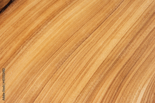 Style wooden slab, saw cut wood treated with varnish close-up on black. Isolate.