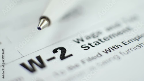 w 2 tax form with pen in 2017