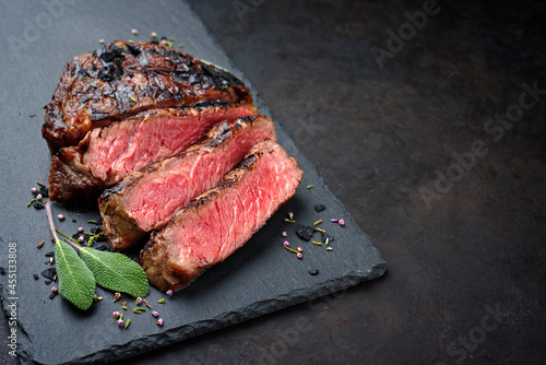 Bild auf Leinwand Barbecue dry aged wagyu rib-eye beef steaks with herb and black salt served as c