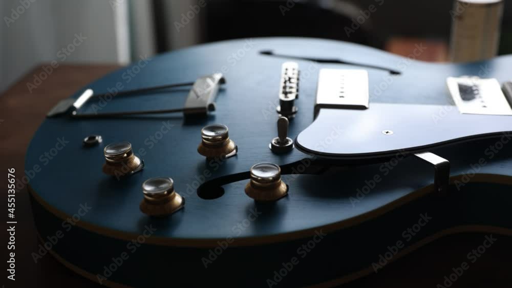 Blue arch top guitar on table No strings Blue arch top guitar on table No strings