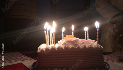 birthday cake with candles black background 
