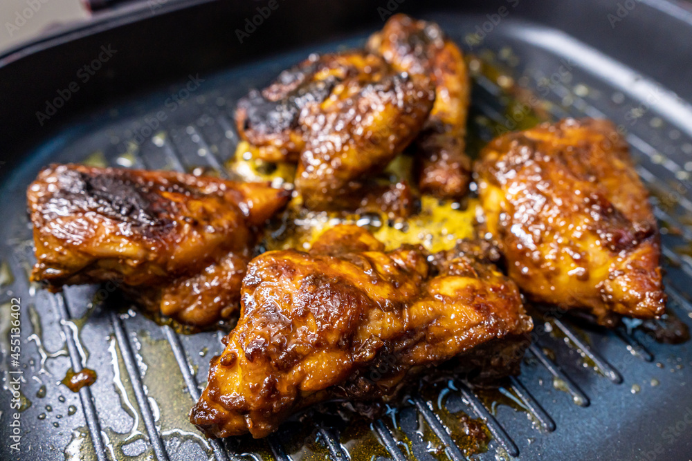 Indonesian Traditional Chicken Grilled on Top of Skillet Indonesian Traditional Chicken Grilled on Top of Skillet