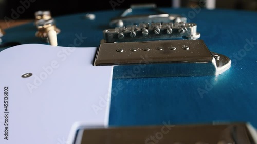 Blue guitar in repair on the table Dolly back
