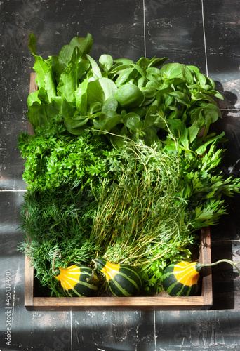 Caraway leaves, parsley, dill, lettuse and pumpkin photo