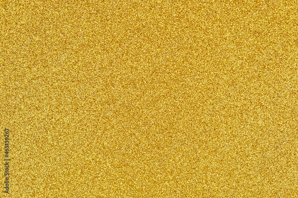 Golden shiny glitter texture for festive background Golden shiny glitter texture for festive background