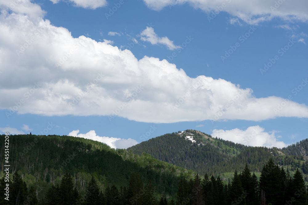 Wasatch mountains of Utah in the light and shadow of overhead clouds Wasatch mountains of Utah in the light and shadow of overhead clouds