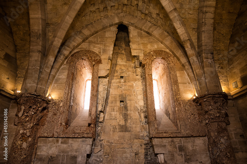 Internal wall of Castel del Monte with arch and marble columns (Italy)