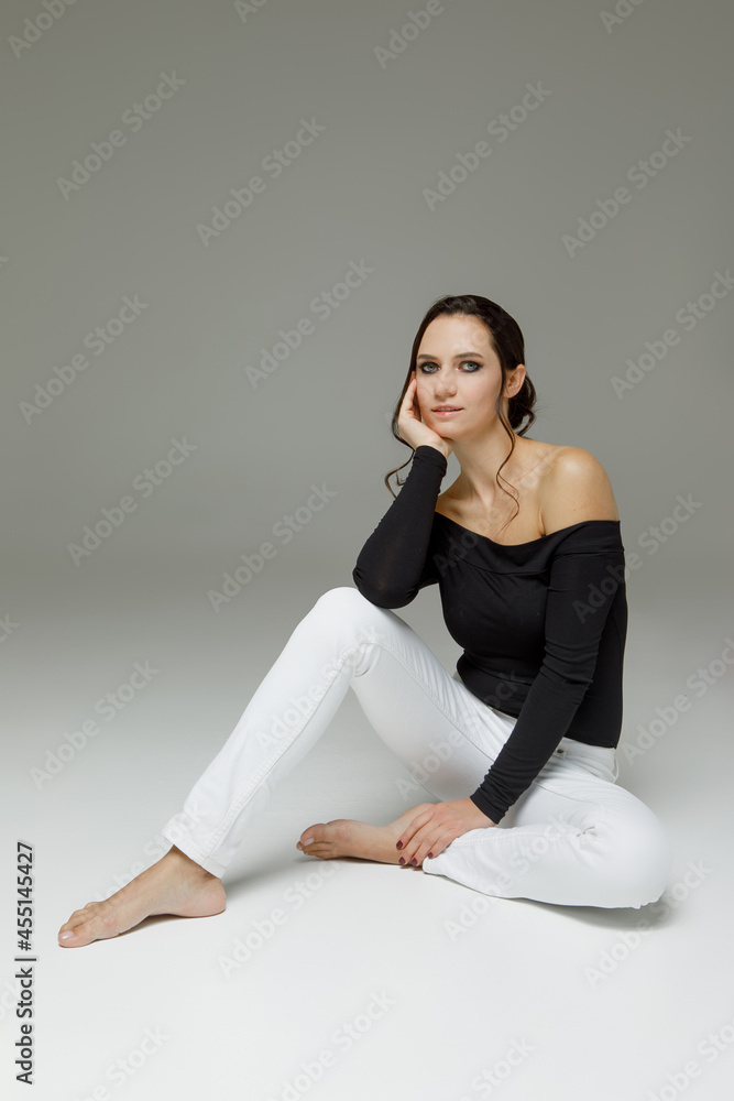 Young woman with smoky eyes makeup in studio in studio Young woman with smoky eyes makeup in studio in studio