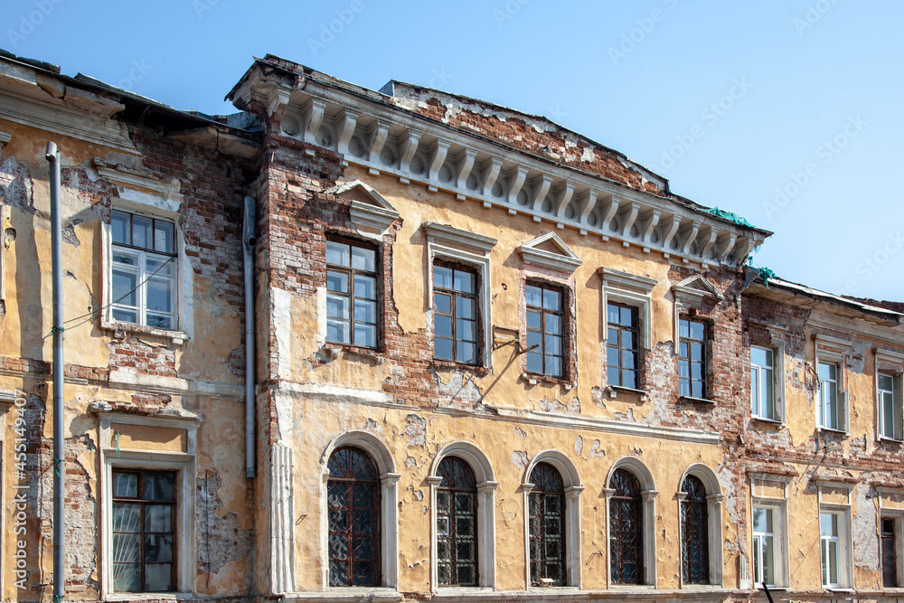 old city building, with a damaged and dilapidated facade