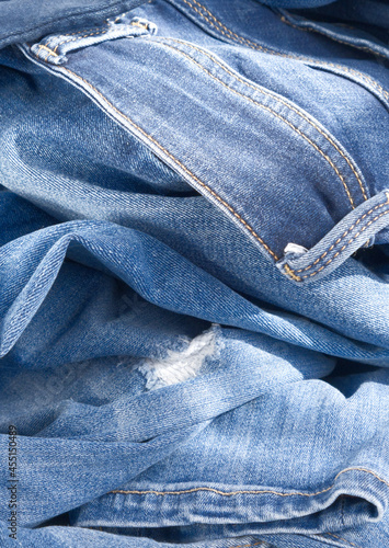background of blue crumpled jeans. Close up  (ID: 455150489)