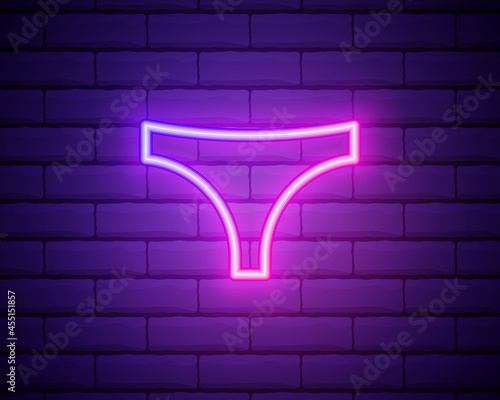Glowing neon line woman Underwear icon isolated on brick wall background. Vector Illustration