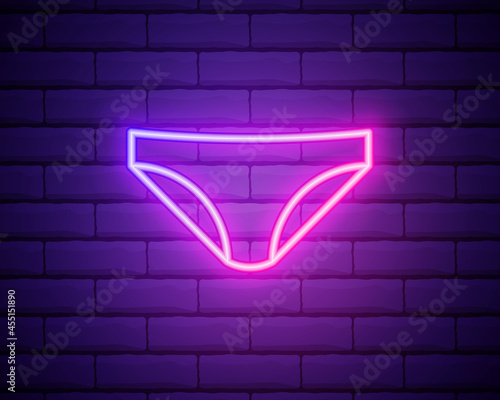 Glowing neon line woman Underwear icon isolated on brick wall background. Vector Illustration