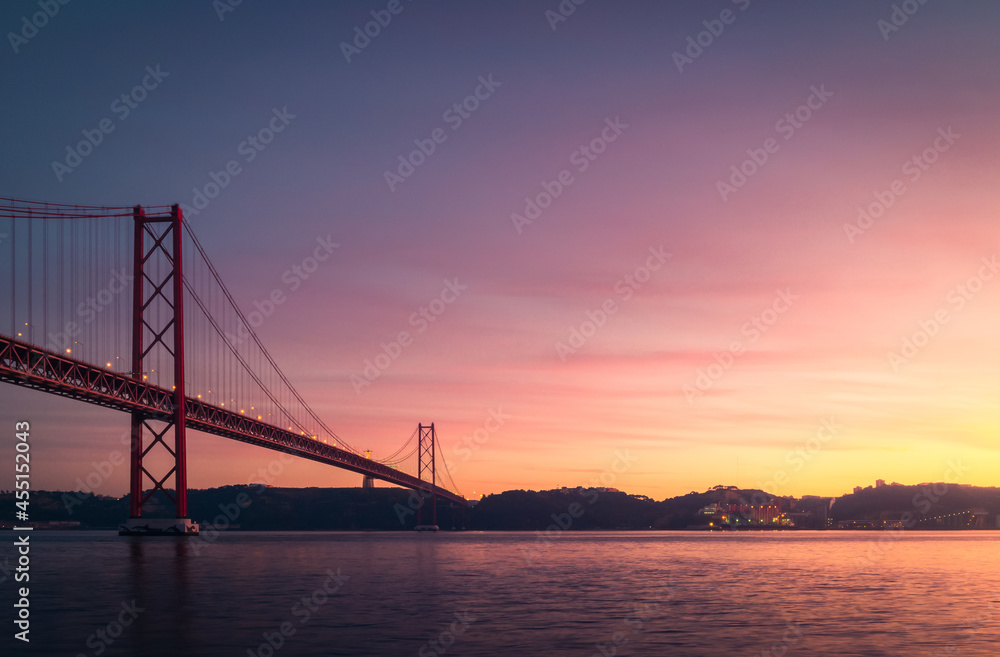 Modern bridge over river at sunset Modern bridge over river at sunset