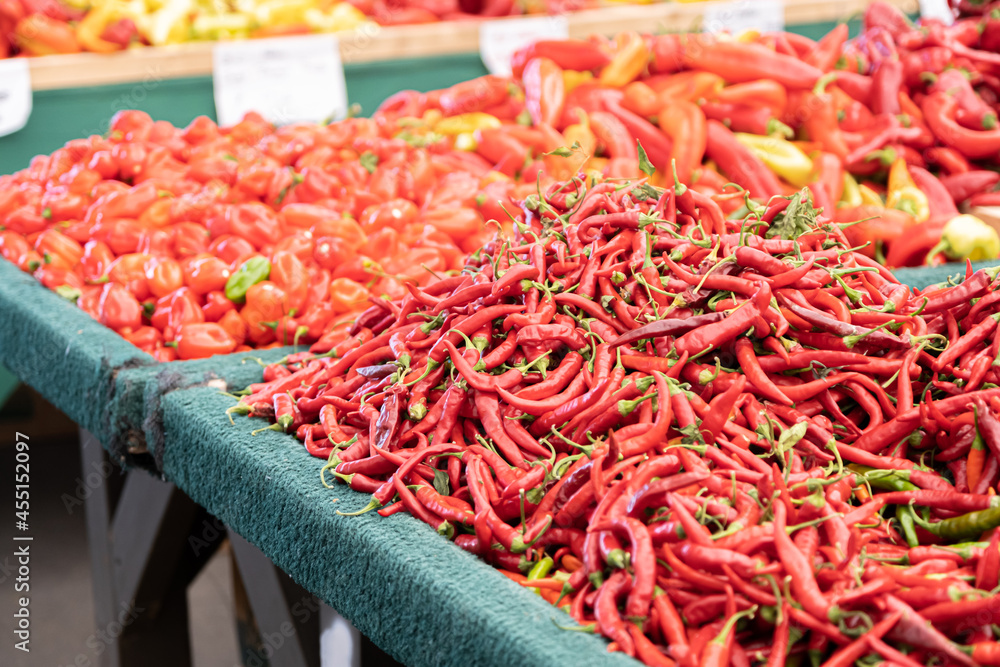 Fototapeta premium fresh organic Chili Peppers on display at a farmers market