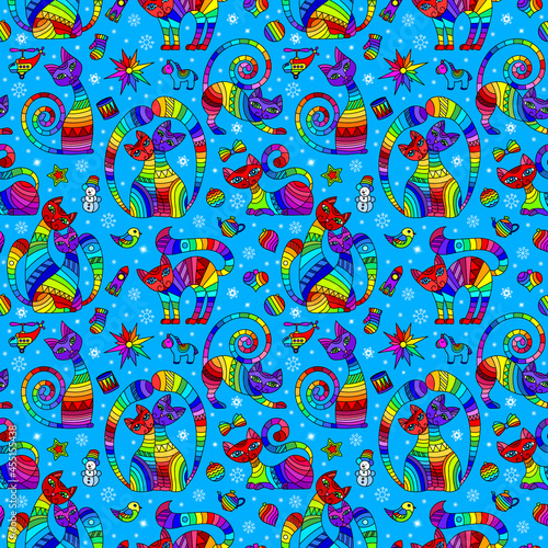 Seamless pattern on the theme of new year and Christmas with bright cats and toys on a blue background