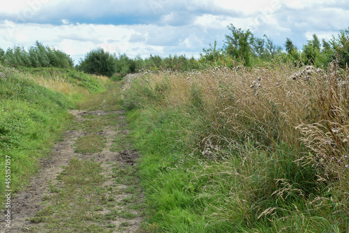 Single track lane on a muddy footpath walking route