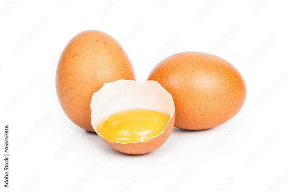 three eggs, one broken egg, egg yolk, isolated on a white background three eggs, one broken egg, egg yolk, isolated on a white background