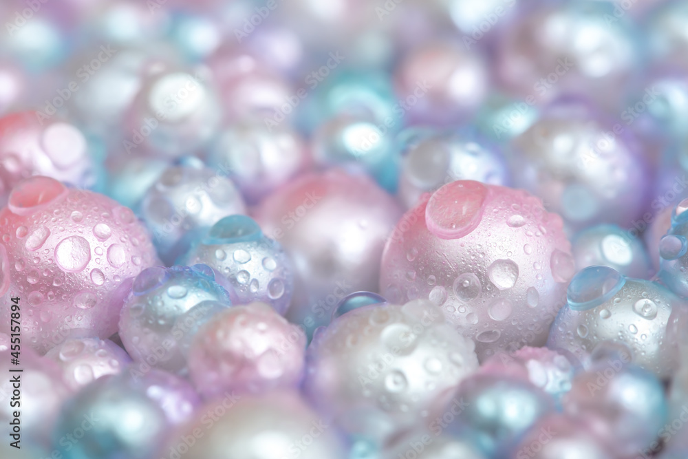 Beautiful background with pearl pearls, top view. Abstract texture for festive backgrounds. Shiny surface of Christmas decorations. Gems close-up. Multicolored bright background. Beautiful background with pearl pearls, top view. Abstract texture for festive backgrounds. Shiny surface of Christmas decorations. Gems close-up. Multicolored bright background.
