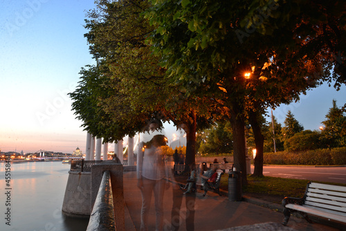 blurry people in a night park