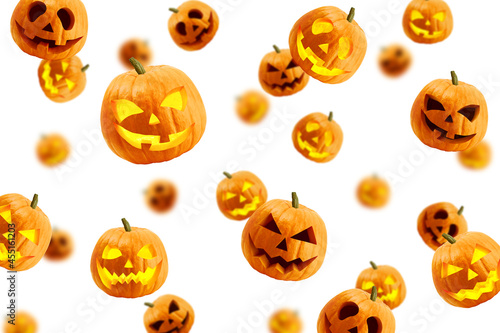 Falling Halloween pumpkin isolated on white background, selective focus