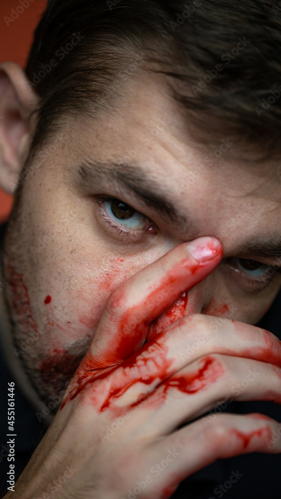 Obraz premium portrait of a guy with a broken nose on a red background