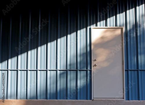 Wallpaper Mural Metal building background. Steel Building wall with door and light pattern Torontodigital.ca