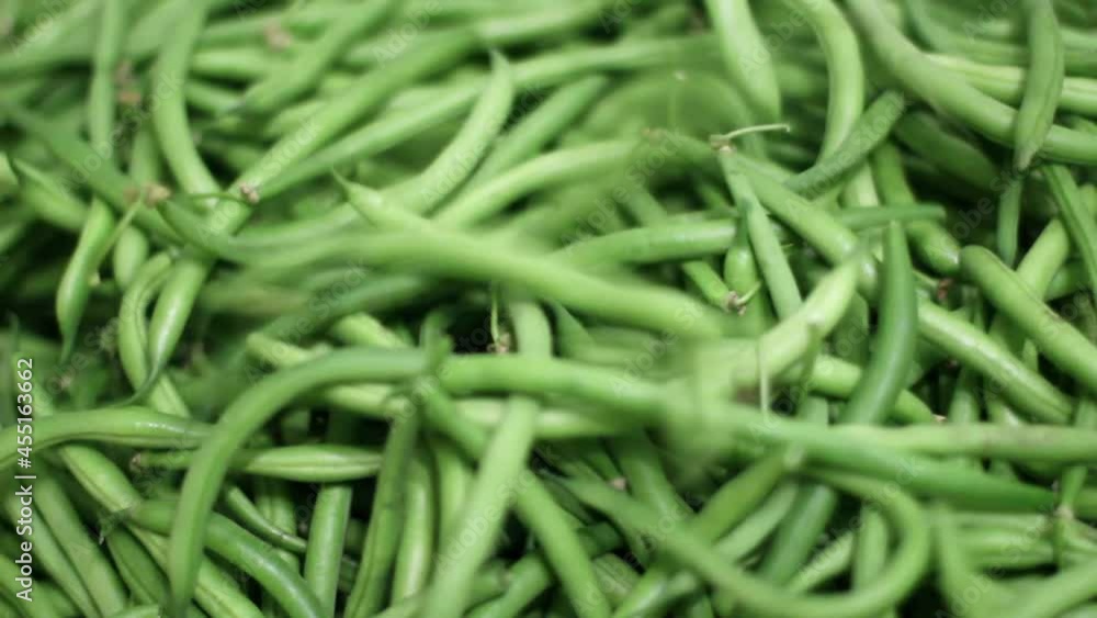 Fall movement of environmentally friendly raw green string beans. Fall movement of environmentally friendly raw green string beans.