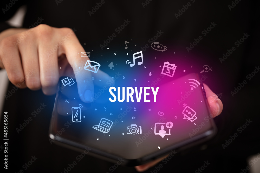 Businessman holding a foldable smartphone, social media concept Businessman holding a foldable smartphone, social media concept