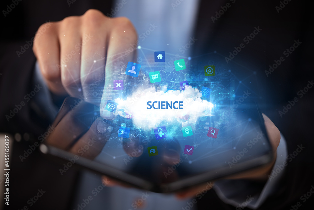 Businessman holding a foldable smartphone, technology concept Businessman holding a foldable smartphone, technology concept