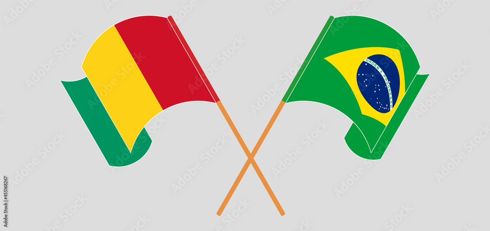 Crossed and waving flags of Guinea and Brazil Crossed and waving flags of Guinea and Brazil