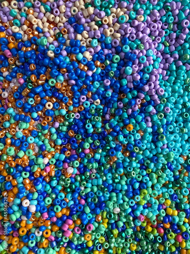 Abstract background of a colorful swirl of seed beads Abstract background of a colorful swirl of seed beads