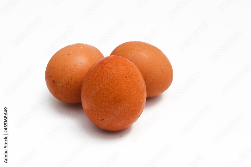 a Group of brown chicken eggs isolated on white background. a Group of brown chicken eggs isolated on white background.